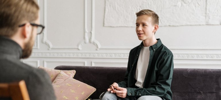 a teen talking to a therapist 