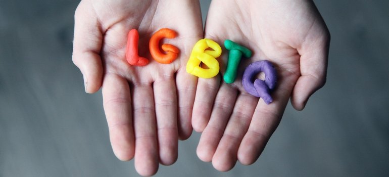 LGBTQ letters in a palm