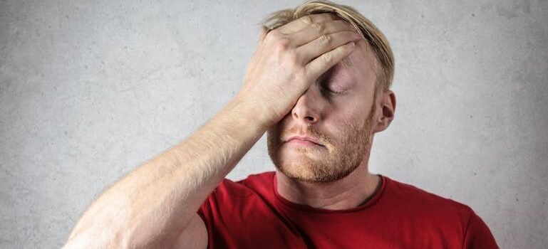 an unhappy man thinking about the relationship between alcoholism and narcissism