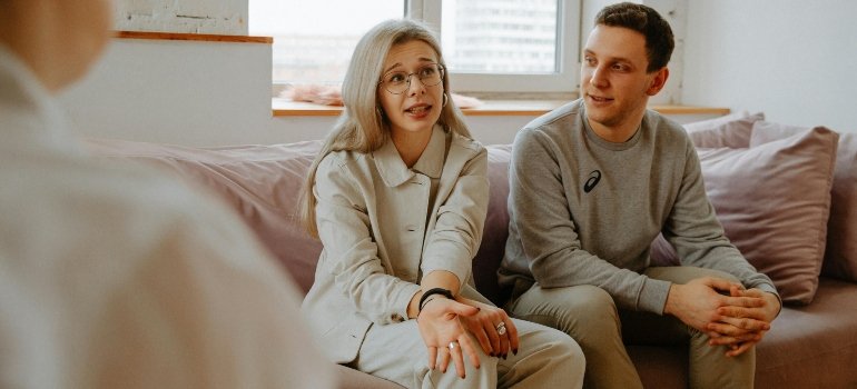 A couple talking to a therapist about the impact of parental addiction on child development in PA