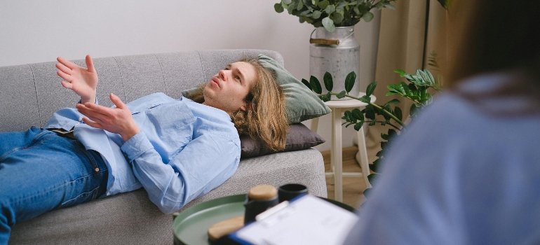 A man in a therapy session talking about the danger of mixing lexapro with alcohol