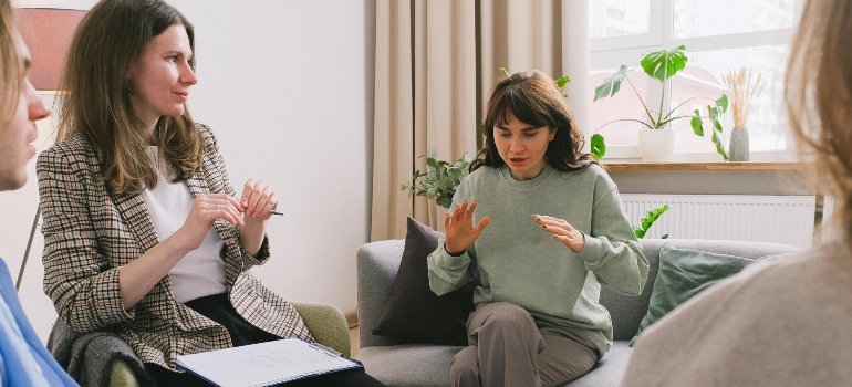 A woman in therapy talking about the danger of mixing Lexapro with alcohol