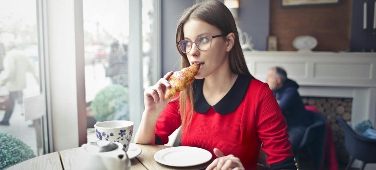 a woman eating in a restaurant 