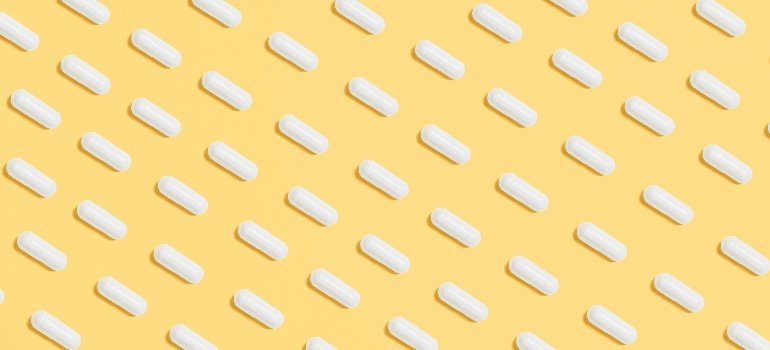 White pills on a yellow background