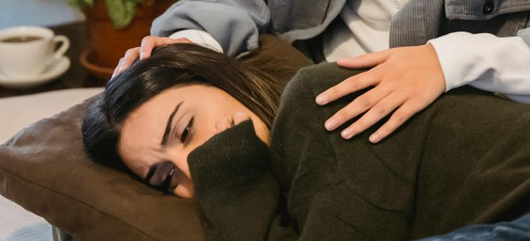 Person supporting a woman crying.