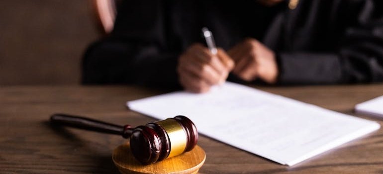 Judge signing a document.