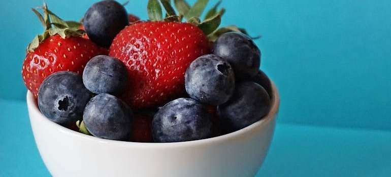 Bowl of strawberries and blueberries, one of the best foods for detoxing from drugs.