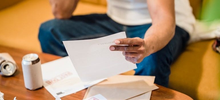 Man holding a bill in his hand.
