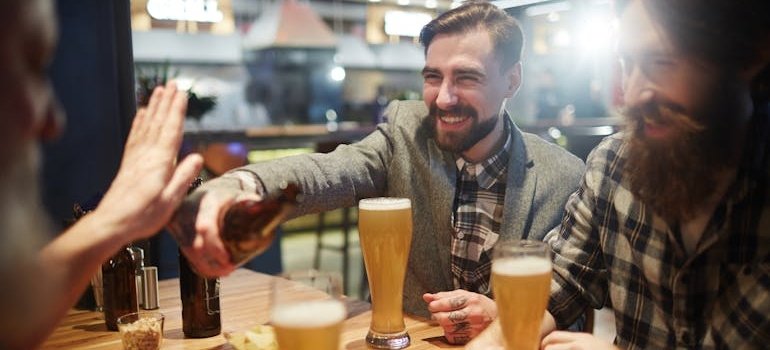 Person refusing a beer.