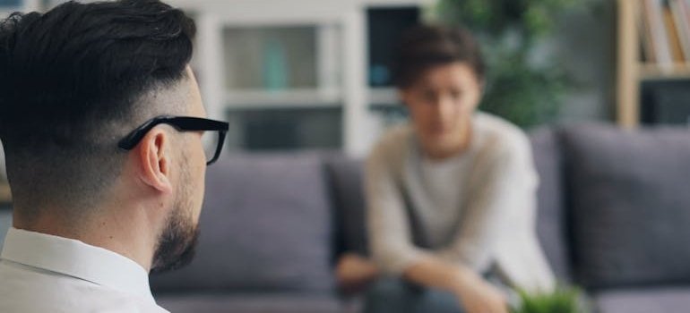 Woman talking about how to stay sober at a party with her therapist.