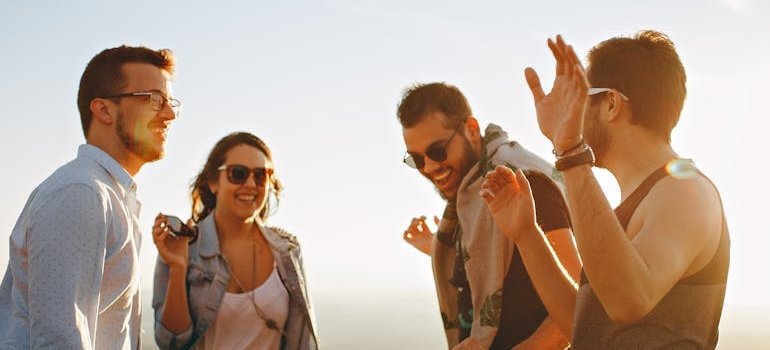 Four friends laughing and talking.