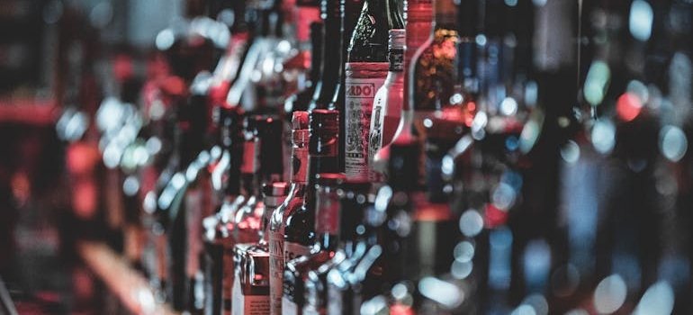 Bottles of alcohol on a bar.