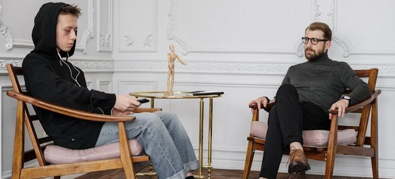 Young man talking about his struggles with cocaine and depression with his therapist.