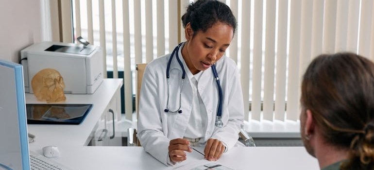 Doctor talking about Restoril and Melatonin options to her patient.