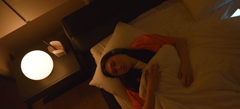 Woman having trouble sleeping during her first week in rehab.