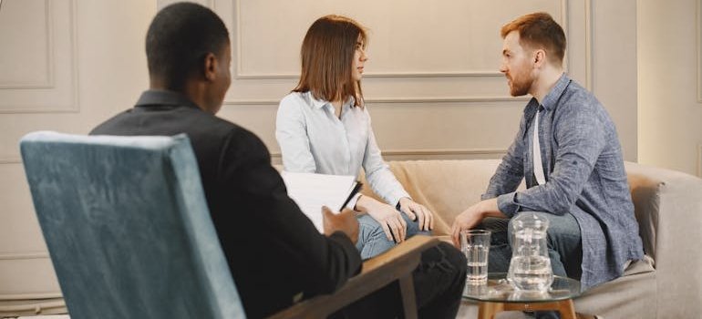 Couple talking while attending a therapy session.