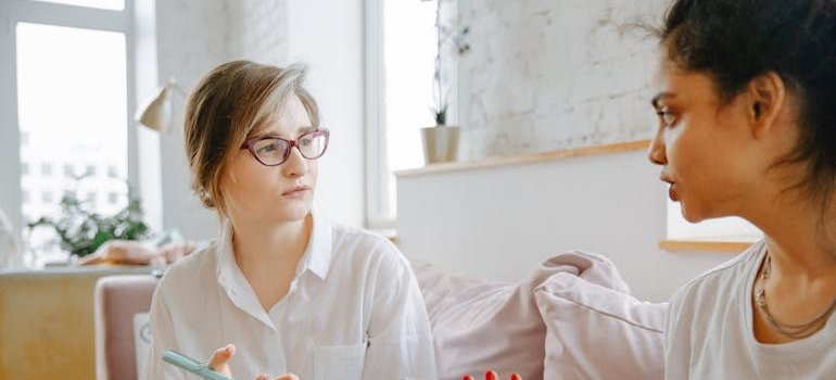 Therapist talking to her client about how to help adult child with addiction.