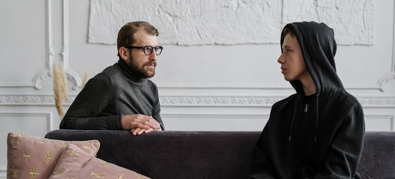 Therapist talking about how drugs influence a person's emotions, perceptions, and behavior with his patient.