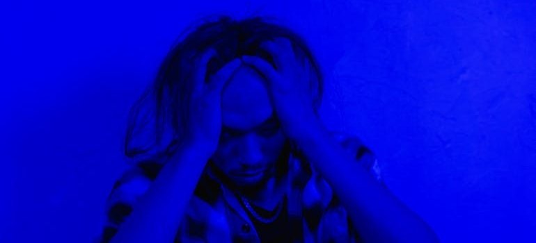 Man holding his head in pain.