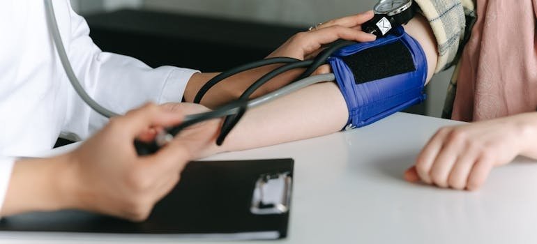 Person getting their blood pressure checked.