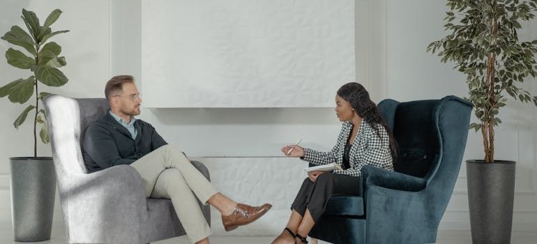 Therapist talking to her patient. 