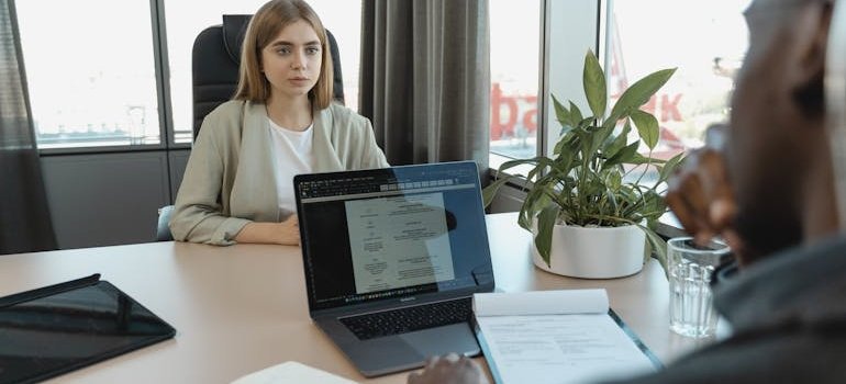 Woman talking to HR about how to go to rehab without losing your job.