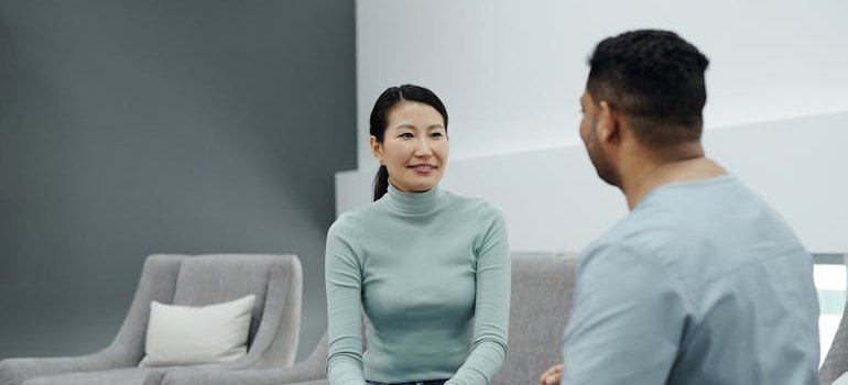Woman talking to a doctor.