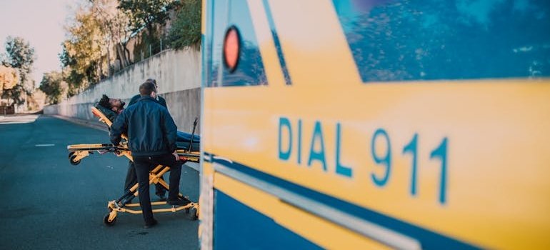 First responders in front of an ambulance.