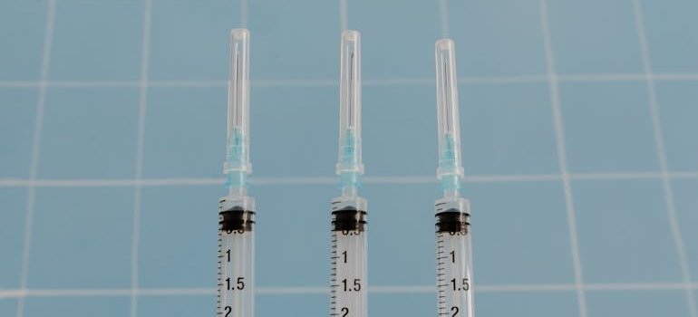 Three clean syringes.