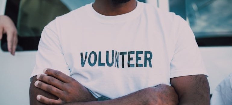 Person wearing a volunteer t-shirt.