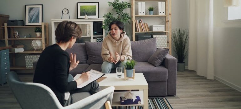 Therapist explaining how to talk about trauma in therapy with her patient.