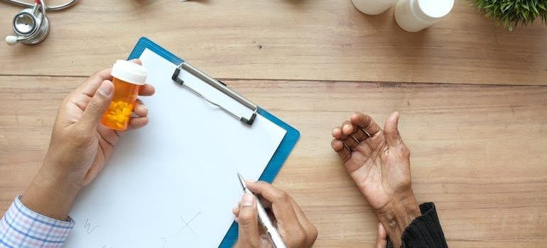Doctor showing pills to a patient and talking about does gabapentin help with opiate withdrawal.