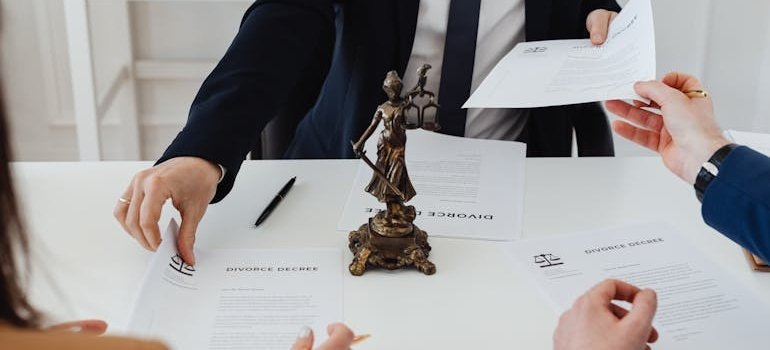 Couple receiving divorce papers by a lawyer.