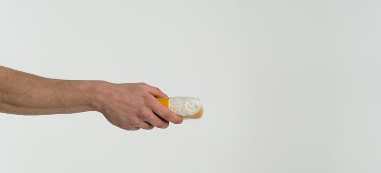 Person holding a package of fish scale cocaine.