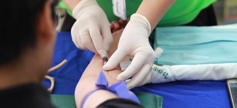 Person getting their blood drawn as part of detox for poly addict treatment.