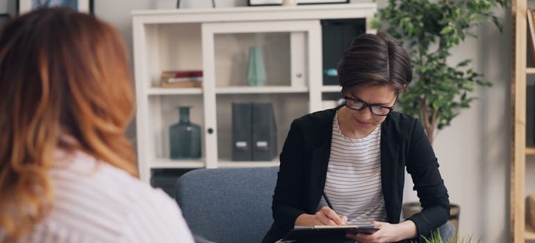Woman talking to her therapist about transfer addiction.