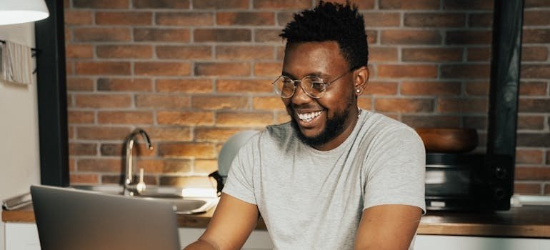 Man booking sober vacations on his laptop.