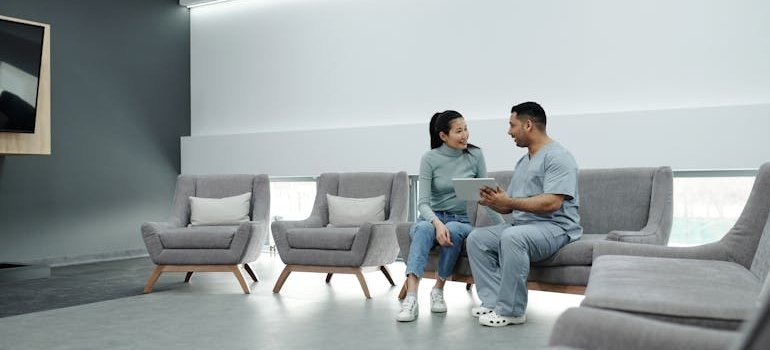 Woman talking to a doctor.