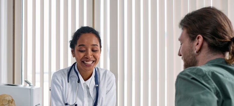 Doctor talking about what are blues drugs with a patient.