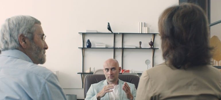 Older couple in therapy during senior addiction treatment.