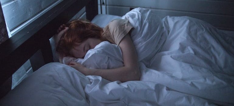 Woman sleeping soundly in a bed.