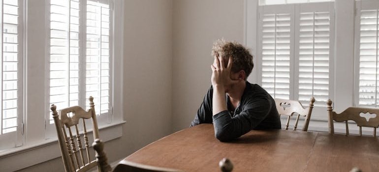 Man sitting at the table and experiencing Concerta withdrawal.