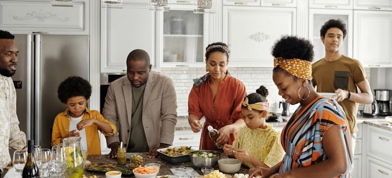 Big family making lunch in the kitchen.