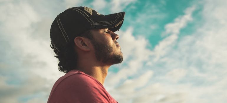 Man practicing mindfulness by doing breathing exercises.