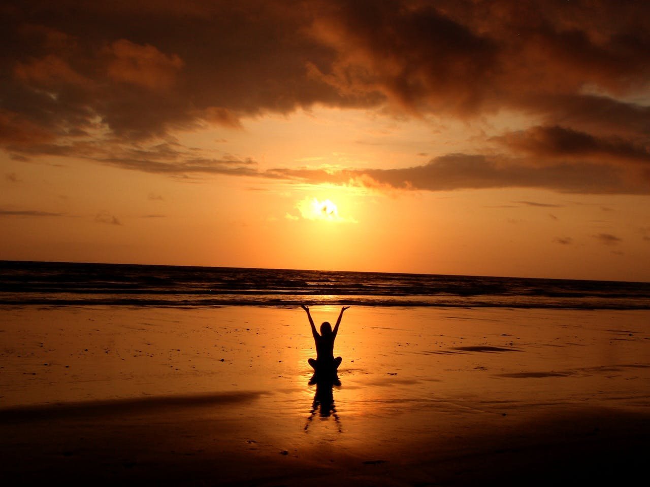 Woman sitting on the beach.