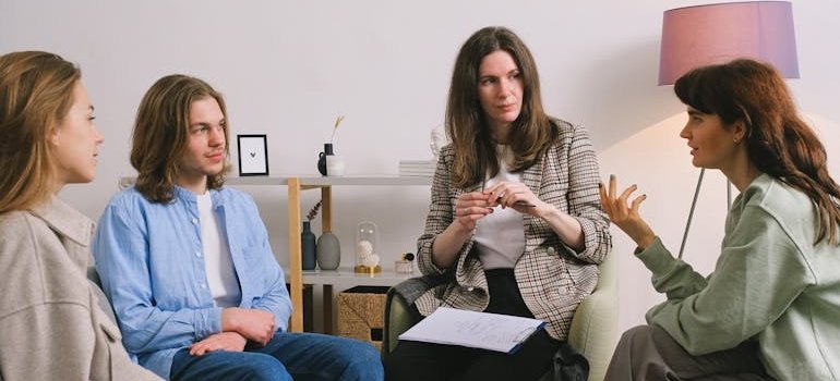 People discussing their issues in group therapy.