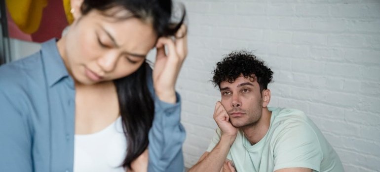 Man looking at his girlfriend and worrying about being in a relationship with an addict in recovery.