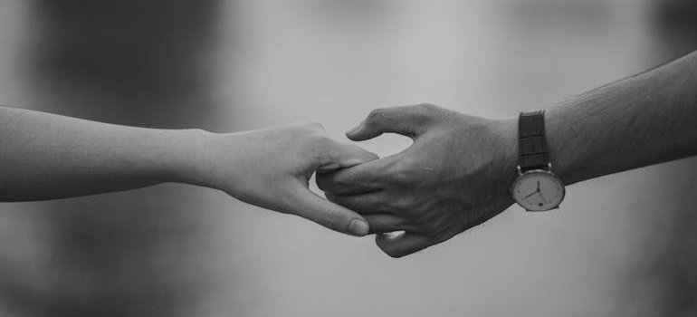 Two people holding hands.