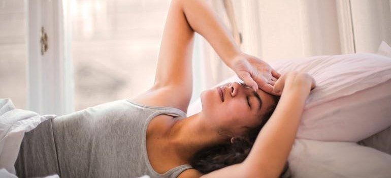 Woman having a headache and wondering is Tramadol addictive.