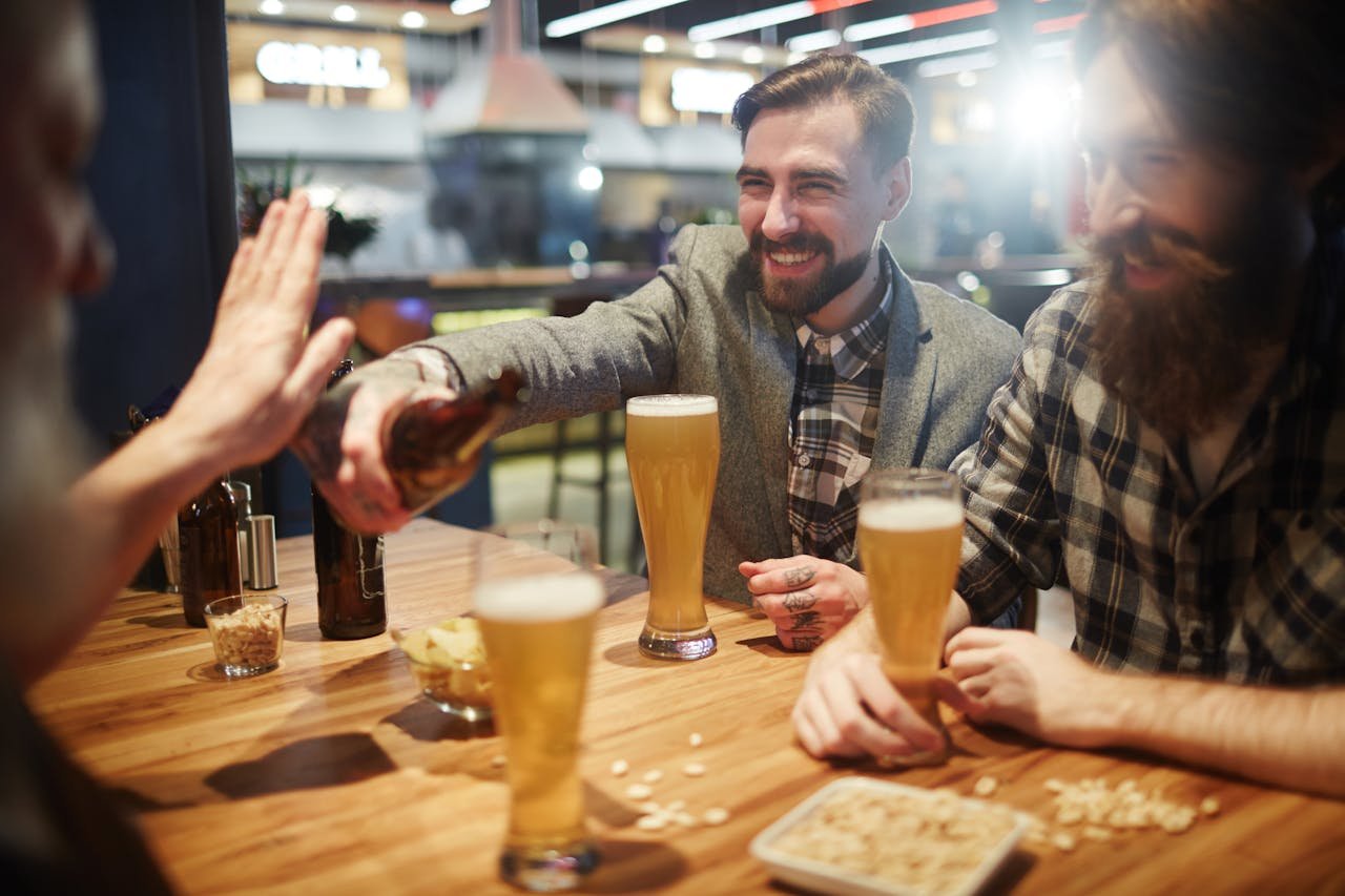 Friends offer beer to a person who is trying to cut back on drinking.